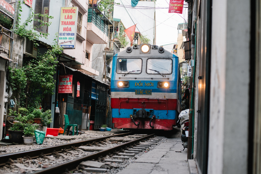 A passenger train on what is referred to as Train Street near Le Duan Street in Hanoi.