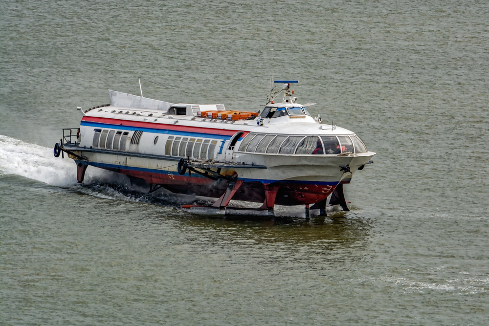 A passenger boat on hydrofoils moves down the Saigon River in Vietnam.