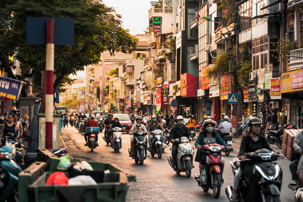 A busy street at sunset in Hanoi.