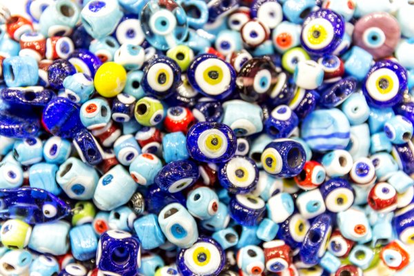 The image of a open eye, a popular amulet against the Evil Eye, helped protect babies and children vulnerable to its harmful gaze. 