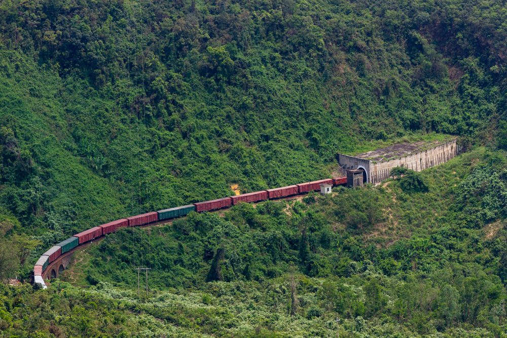 A freight train enters a tunnel in Hải Vân Pass.