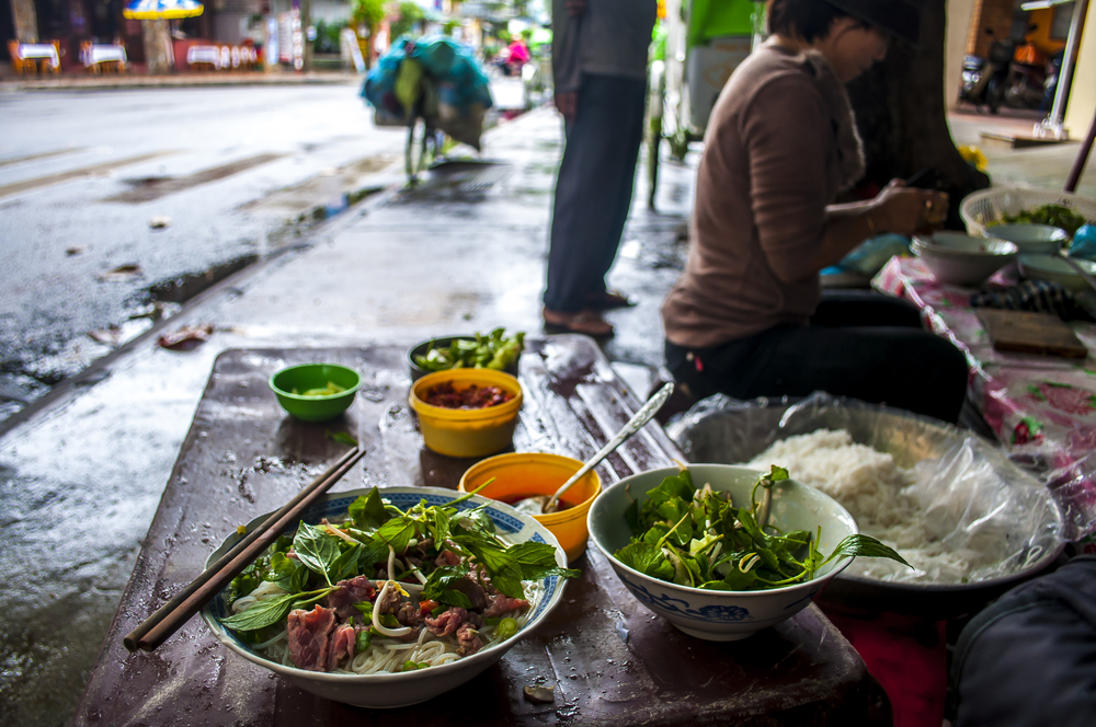 Pho, the classic Vietnamese soup of broth, rice noodles, herbs, and meat, is a popular street food traditionally eaten at breakfast time.