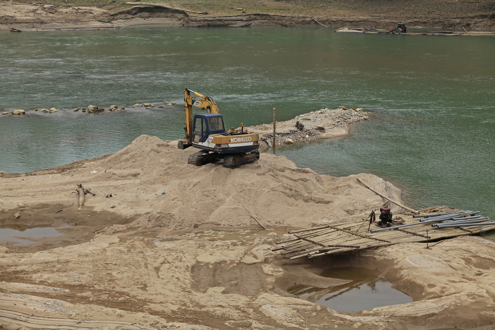 Sand mining, pictured along Vietnam's Chay River, causes habitat degradation and loss.