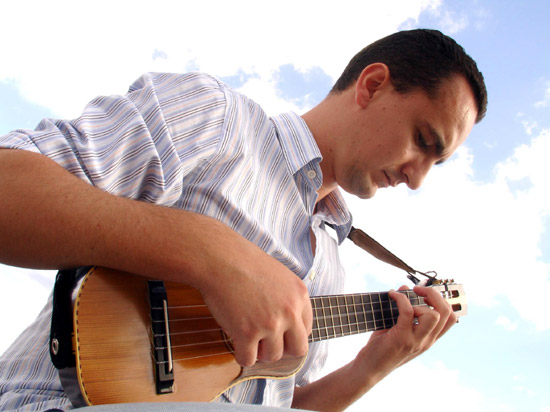 Pedro Izquierdo plays a <i>timple.</i>