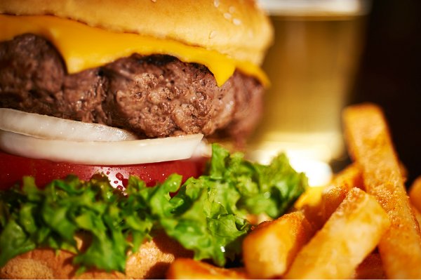 Close-up of a hamburger with fries