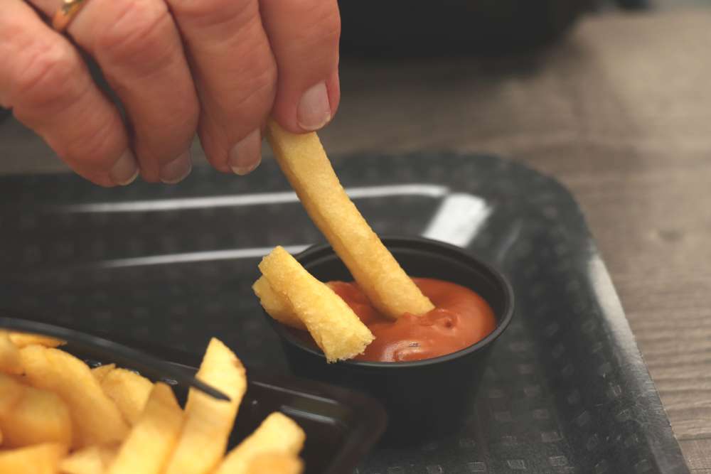 Dipping Dutch French Fries in Peanut Sauce