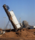 Truck unloading wood chips